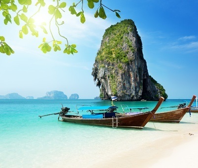 Thai beach with local boats ashore