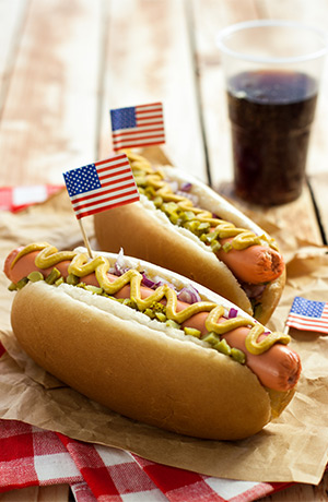 two hot dogs with American flags on them