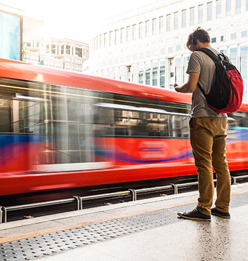 person standing in front of an british train