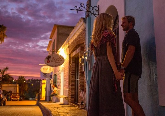 Couple holding hands in the sunset